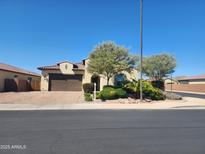 Charming single-story home features a two-car garage, landscaped yard, and lovely curb appeal at 4866 N 185Th Dr, Goodyear, AZ 85395