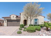 Single-story home with landscaped yard and two-car garage at 4866 N 185Th Dr, Goodyear, AZ 85395