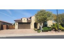 Charming single-story home features a well-maintained yard, tiled roof, and welcoming two-car garage at 4866 N 185Th Dr, Goodyear, AZ 85395