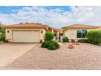 Single-story home with two-car garage and desert landscaping at 9405 E Cherrywood Dr, Sun Lakes, AZ 85248