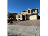 Charming two-story home with stucco exterior, tile roof, and a two-car garage at 2738 E Cherry Hill E Dr, Gilbert, AZ 85298