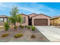 One-story home with desert landscaping and two-car garage at 2969 E Hayfield Way, San Tan Valley, AZ 85140