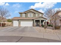 Two-story house with a three-car garage and desert landscaping at 4642 W Alabama Ln, San Tan Valley, AZ 85144