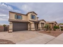 Two-story house with a brown garage door and landscaping at 1923 E Zion Way, Chandler, AZ 85249