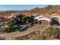 Luxury home with courtyard and fountain; mountain backdrop at 4362 N Diamond Point Cir, Mesa, AZ 85207