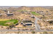 Expansive aerial view of a luxury home bordering a golf course in a desert community at 3703 S Avenida De Angeles --, Gold Canyon, AZ 85118