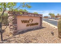 Stone entrance sign for Vista del Corazon community, showcasing natural desert landscaping and a welcoming atmosphere at 3703 S Avenida De Angeles --, Gold Canyon, AZ 85118