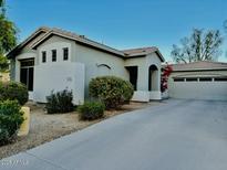 Single-story home with attached two-car garage and landscaped front yard at 5185 S Eileen Dr, Chandler, AZ 85248