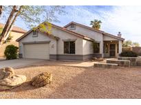 One-story house with a two-car garage and landscaped front yard at 1427 S Western Skies Dr, Gilbert, AZ 85296