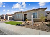 Single-story home with a two-car garage and landscaped front yard at 19045 N 269Th Dr, Buckeye, AZ 85396