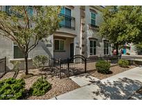 Two-story townhome with front patio and wrought-iron fence at 4733 E Portola Valley Dr # 102, Gilbert, AZ 85297