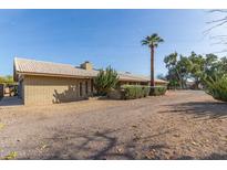 Ranch style home with a large yard and mature trees at 8919 N 95Th Ave, Peoria, AZ 85345