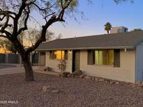 Charming ranch house with a well-maintained front yard at 2016 E Aspen Ave, Mesa, AZ 85204
