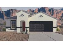 One-story house with a two-car garage and desert landscaping at 25425 W Graham Trl, Buckeye, AZ 85326