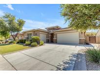 Single-story home with a two-car garage and landscaped front yard at 3957 E Beechnut Pl, Chandler, AZ 85249