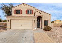 Two-story house with a large garage and a landscaped front yard at 5674 S 237Th Dr, Buckeye, AZ 85326