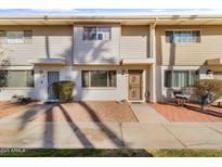 Inviting exterior of a charming condo with a well-maintained front yard and patio at 8220 E Garfield St # M20, Scottsdale, AZ 85257