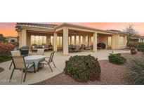 Spacious backyard patio with seating area, grill, and lush landscaping at 13219 W Santa Ynez Dr, Sun City West, AZ 85375