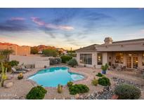 Spacious backyard oasis featuring a sparkling pool and mountain views at 22719 N 93Rd St, Scottsdale, AZ 85255
