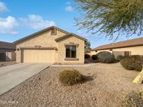 Single-story house with a two-car garage and desert landscaping at 6546 E Casa De Risco Ln, Gold Canyon, AZ 85118