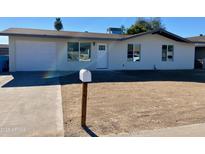 Newly renovated single story home with a clean, modern design and spacious yard at 8323 W Devonshire Ave, Phoenix, AZ 85037