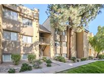 Attractive exterior of a two-story building with landscaping and walkway at 18811 N 19Th Ave # 3018, Phoenix, AZ 85027