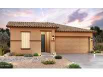 One-story home with tan exterior, tile roof, and two-car garage at 24177 W Hilton Ave, Buckeye, AZ 85326