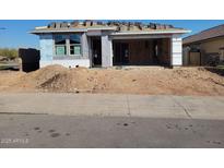 New construction home with unfinished landscaping and driveway at 31277 N 130Th Ave, Peoria, AZ 85383