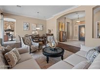 Spacious living room with hardwood floors and ample natural light at 42034 N Harbour Town Ct, Anthem, AZ 85086
