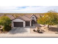 Single-story house with two-car garage and desert landscaping at 47970 N Navidad Ct, Gold Canyon, AZ 85118