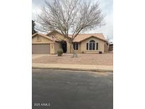 Single-story home with a tile roof and landscaped front yard at 620 S 26Th St, Mesa, AZ 85204