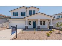Two-story home with gray stone accents and a landscaped front yard at 11035 E Ulysses Ave, Mesa, AZ 85212