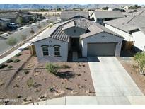 Aerial view of a house with desert landscaping and a two-car garage at 13172 N 174Th Dr, Surprise, AZ 85388