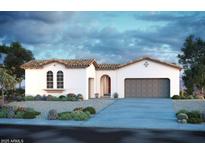 Single-story home with Spanish-style architecture, two-car garage, and desert landscaping at 18116 W Silverwood Dr, Goodyear, AZ 85338