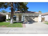 Single-story home with a two-car garage and well-maintained lawn at 2732 W Lamar Rd, Phoenix, AZ 85017
