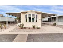 Mobile home exterior with carport and landscaping at 300 S Val Vista Dr # 152, Mesa, AZ 85204