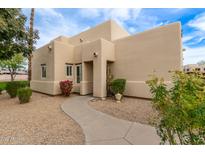 Tan stucco exterior with landscaped walkway at 11333 N 92Nd St # 1131, Scottsdale, AZ 85260