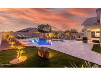 Stunning backyard oasis featuring a sparkling pool and spa, perfect for relaxation at 18305 W Georgia Ave, Litchfield Park, AZ 85340