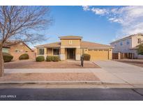 Single-story house with tan exterior, landscaped yard, and driveway at 18526 E Swan Dr, Queen Creek, AZ 85142