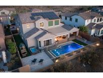 Two-story home with solar panels, pool, spa, and landscaped backyard at 27410 N 16Th Ave, Phoenix, AZ 85085