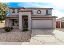 Two-story house with a large garage and desert landscaping at 3109 E Denim Trl, San Tan Valley, AZ 85143