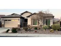 Single-story home with desert landscaping and a two-car garage at 5822 E Bramble Berry Ln, Cave Creek, AZ 85331