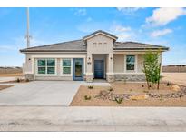 Charming single story home with desert landscaping, stone accents and a concrete driveway at 1167 W Chimes Tower Dr, Casa Grande, AZ 85122