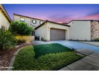 Beautiful two-story home with a landscaped front yard and two-car garage at 4700 S Fulton Ranch Blvd # 62, Chandler, AZ 85248