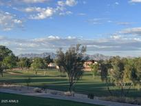Scenic view of a golf course with mountain backdrop, trees and beautiful blue sky at 7800 E Lincoln Dr # 2047, Scottsdale, AZ 85250