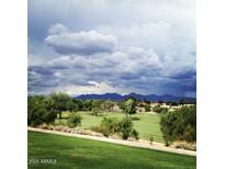 Scenic view of a lush green golf course with mountains in the background at 7800 E Lincoln Dr # 2047, Scottsdale, AZ 85250