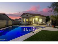 Stunning backyard oasis with a sparkling pool at 10283 E Fortuna Ave, Gold Canyon, AZ 85118