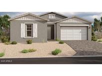 One-story home with gray exterior, white garage door, and landscaped front yard at 11446 E Utah Ave, Mesa, AZ 85212