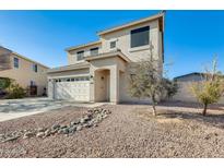 Two-story house with a landscaped front yard and a two-car garage at 14614 N 153Rd Ct, Surprise, AZ 85379