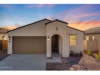 Single-story home with a two-car garage and desert landscaping at 18111 W Hiddenview Dr, Goodyear, AZ 85338